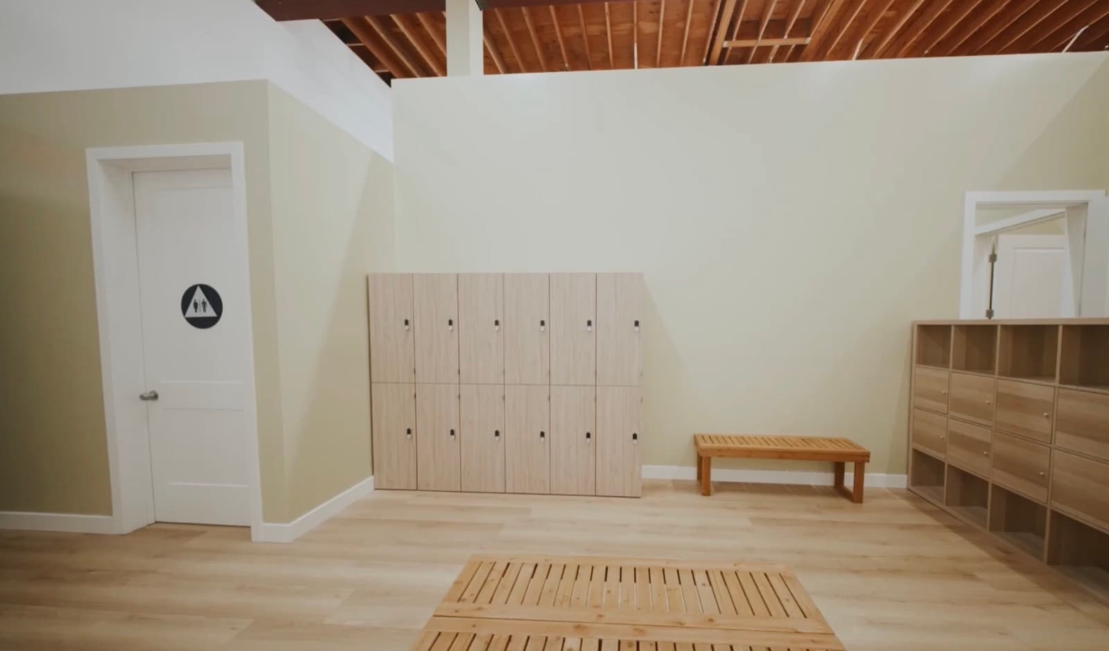Lockers, a bench, and shelves in the changing area at Dream Big Dance