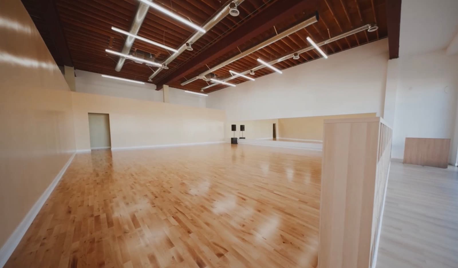 Wide view of the hardwood dance floor at Dream Big Dance